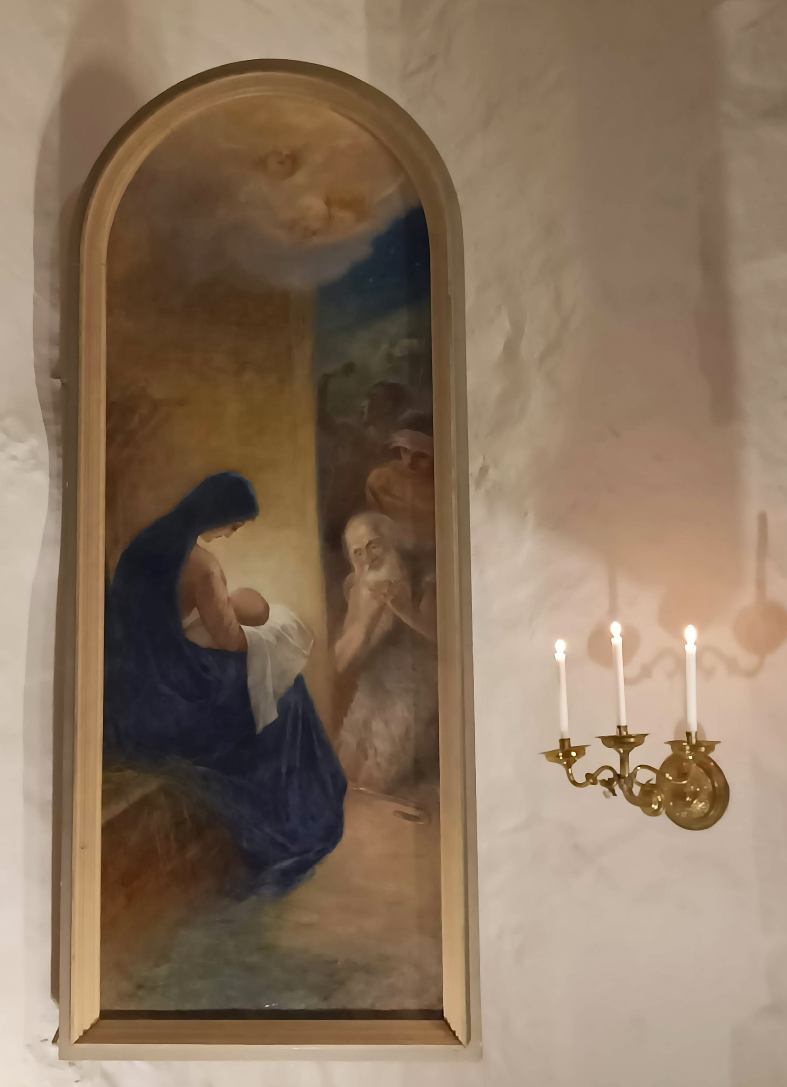 Kuva Kaarlelan kirkossa olevasta maalauksesta, jossa Neitsyt Maria Jeesus-lapsi sylissään.